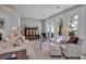 Bright living room with neutral furniture and floor-to-ceiling sliding glass doors to the outside at 980 S Orange Ave, Sarasota, FL 34236