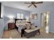 Comfortable main bedroom featuring neutral colors, ceiling fan, and carpet flooring at 980 S Orange Ave, Sarasota, FL 34236