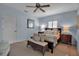 Comfortable main bedroom featuring neutral colors, ceiling fan, and carpet flooring at 980 S Orange Ave, Sarasota, FL 34236