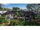 Relaxing screened-in pool area surrounded by lush landscaping, perfect for entertaining and enjoying the Florida lifestyle at 980 S Orange Ave, Sarasota, FL 34236