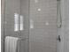 Modern shower with glass doors and white subway tile, offering a clean and stylish design at 980 S Orange Ave, Sarasota, FL 34236