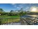 Beautiful backyard view overlooking the lush green landscape and sparkling pool at 9818 Old Hyde Park Pl, Bradenton, FL 34202