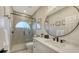Modern bathroom with a glass-enclosed shower, sleek vanity, and contemporary fixtures at 9818 Old Hyde Park Pl, Bradenton, FL 34202