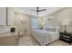 Elegant bedroom features a comfortable bed, stylish decor, and plenty of natural light at 9818 Old Hyde Park Pl, Bradenton, FL 34202