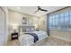 Inviting bedroom with a comfortable bed, stylish nightstands, and a bright window at 9818 Old Hyde Park Pl, Bradenton, FL 34202