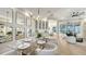 Spacious dining room with wine storage, stylish lighting, and seamless access to the living area at 9818 Old Hyde Park Pl, Bradenton, FL 34202