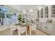 Well-lit dining room featuring modern furniture and elegant decor at 9818 Old Hyde Park Pl, Bradenton, FL 34202