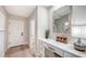 Bright entryway features a desk with marble counters, drawers, and a decorative mirror at 9818 Old Hyde Park Pl, Bradenton, FL 34202