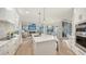 Open-concept kitchen showcasing a spacious island, sleek cabinets, and top-of-the-line appliances at 9818 Old Hyde Park Pl, Bradenton, FL 34202