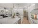 Open-concept kitchen with large island, seamlessly connected to the living and dining spaces at 9818 Old Hyde Park Pl, Bradenton, FL 34202