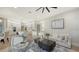 Spacious living room with open floor plan connecting to a modern kitchen at 9818 Old Hyde Park Pl, Bradenton, FL 34202