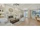 Cozy living room with a fireplace, comfortable seating, and elegant decor at 9818 Old Hyde Park Pl, Bradenton, FL 34202