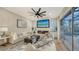 Inviting living room offers stylish decor, plush seating, and a view of the outdoor area at 9818 Old Hyde Park Pl, Bradenton, FL 34202