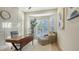 Inviting home office with a modern desk, stylish chair, and abundant natural light at 9818 Old Hyde Park Pl, Bradenton, FL 34202