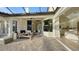Covered patio area with comfortable seating and seamless indoor-outdoor flow at 9818 Old Hyde Park Pl, Bradenton, FL 34202
