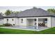Relaxing backyard with a swimming pool, outdoor dining space, and cozy seating arrangement at 10 Mast Dr # 1, Placida, FL 33946
