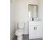 Bathroom features a floating vanity with solid countertops and a modern mirror at 10 Mast Dr # 1, Placida, FL 33946