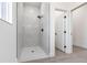 Bright bathroom featuring sleek glass shower with a rain shower head and marble tiling at 10 Mast Dr # 1, Placida, FL 33946