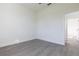 Bright bedroom featuring gray wood floors and easy access to another room at 10 Mast Dr # 1, Placida, FL 33946