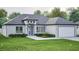 Attractive single-story home boasting a well-manicured lawn and a convenient two-car garage at 10 Mast Dr # 1, Placida, FL 33946
