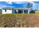The exterior features a covered patio and well-maintained yard at 10 Mast Dr # 1, Placida, FL 33946