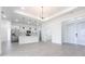 Spacious kitchen with modern white cabinets, stainless steel appliances, and center island overlooking the living area at 10 Mast Dr # 1, Placida, FL 33946