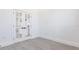 Office featuring gray wood-look vinyl plank flooring and white french doors leading to kitchen at 10 Mast Dr # 1, Placida, FL 33946