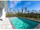Sparkling pool offers a refreshing retreat, surrounded by a fenced yard and mature trees at 10 Mast Dr # 1, Placida, FL 33946