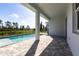 Relaxing back patio overlooking a large pool and beautiful outdoor space at 10 Mast Dr # 1, Placida, FL 33946