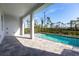Back patio area with a large pool and partially-covered patio at 10 Mast Dr # 1, Placida, FL 33946