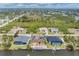 Expansive aerial view showcasing waterfront properties, lush greenery, and serene neighborhood layout at 10494 Atenia St, Port Charlotte, FL 33981
