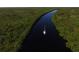 Aerial view of sailboat sailing down the canal with beautiful mangrove views at 10494 Atenia St, Port Charlotte, FL 33981