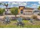 Stunning home featuring stone accents, lush landscaping, and a paved driveway at 10494 Atenia St, Port Charlotte, FL 33981