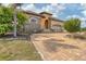 Charming home with stone and stucco exterior, a tiled roof, and circular paved driveway at 10494 Atenia St, Port Charlotte, FL 33981