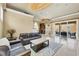 Bright, open-concept living area with modern seating, stylish lighting, and easy access to the outdoor patio at 10494 Atenia St, Port Charlotte, FL 33981