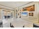 Bright open-concept living area showcasing custom built-ins, sleek marble floors, and easy access to outdoor area at 10494 Atenia St, Port Charlotte, FL 33981