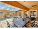 Beautiful outdoor dining area with a large table and a view of the pool and lanai at 10494 Atenia St, Port Charlotte, FL 33981