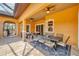 Covered outdoor dining area with stylish furniture and views of the outdoor space and pool at 10494 Atenia St, Port Charlotte, FL 33981