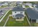 Aerial view of backyard with patio, fenced yard, and green grass at 10803 High Noon Trl, Parrish, FL 34219