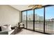 Inviting balcony with comfortable seating and views of surrounding buildings and scenery at 11 Sunset Dr # 303, Sarasota, FL 34236