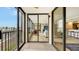 Enjoy panoramic views from this private outdoor balcony with sliding glass doors to the living room at 11 Sunset Dr # 303, Sarasota, FL 34236