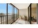 Cozy condo balcony with seating and peaceful water views at 11 Sunset Dr # 303, Sarasota, FL 34236