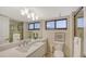 Elegant bathroom with a well-lit vanity, sleek fixtures, and a glass-enclosed shower at 11 Sunset Dr # 303, Sarasota, FL 34236