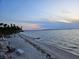 Serene beach scene featuring calm waters and picturesque beachfront seating at 11 Sunset Dr # 303, Sarasota, FL 34236