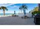 Community picnic area with seating, ocean views, and a grill at 11 Sunset Dr # 303, Sarasota, FL 34236
