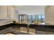 Contemporary kitchen with a stainless steel sink, dark granite countertops, and views of the water from the window at 11 Sunset Dr # 303, Sarasota, FL 34236