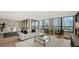 Inviting living room with ample natural light and an adjacent dining area, perfect for entertaining at 11 Sunset Dr # 303, Sarasota, FL 34236