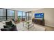 Inviting living room showcasing modern decor, comfortable seating, and large windows with views at 11 Sunset Dr # 303, Sarasota, FL 34236