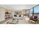 Bright living room with stylish decor, a comfortable sofa, and natural light at 11 Sunset Dr # 303, Sarasota, FL 34236