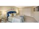 Comfortable bedroom with a plush bed, side tables, and ample closet space for storage at 11 Sunset Dr # 303, Sarasota, FL 34236